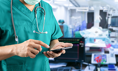 Doctor looking up Dynamic Role on a smartphone